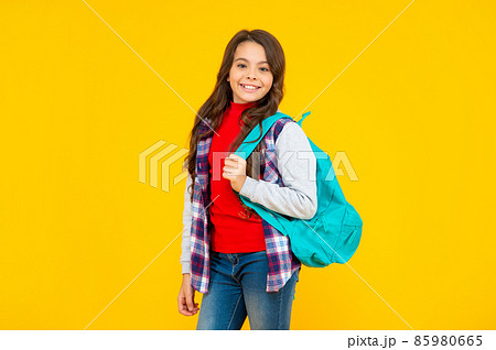 cheerful kid in casual clothes on yellow background. september 1. happy childhood. 85980665