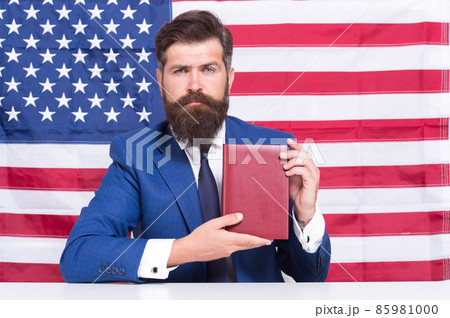 Handsome lawyer man promoting american constitutional liberties, learn constitution concept Handsome lawyer man promoting american constitutional liberties, learn constitution concept 85981000