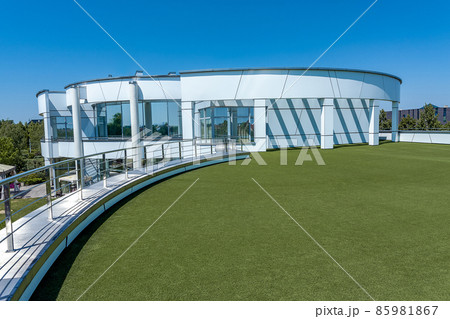 Stylish mansion with terrace on roof of first floor covered with green artificial grass Stylish mansion with terrace on roof of first floor covered with green artificial grass 85981867