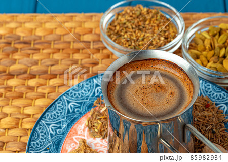 Coffee in metal turk with spices in a plate 85982934