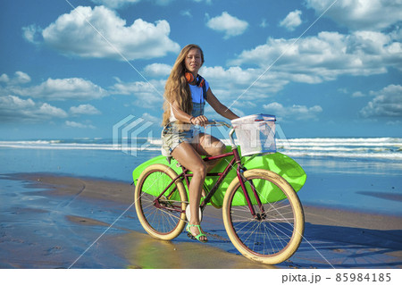 Young woman at the ocean coastline Young woman at the ocean coastline 85984185