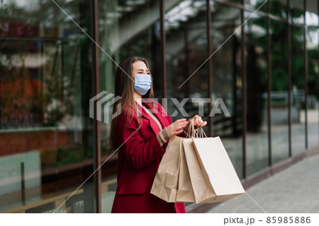 Young woman with a face mask in restaurant, New normal concept for protect coronavirus pandemic Young woman with a face mask in restaurant, New normal concept for protect coronavirus pandemic 85985886