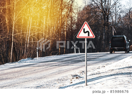 Driving on a winter road Driving on a winter road 85986676