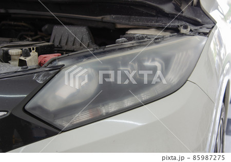 Car headlights before polishing. car details 85987275