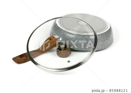 Modern frying pan with non-stick granite coating with wooden handle isolated on white background, top view. Modern frying pan with non-stick granite coating with wooden handle isolated on white background, top view. 85988121