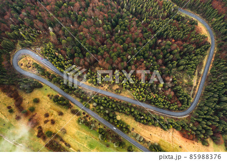 Winding road in the mountains, serpentines and sharp turns on the road. Winding road in the mountains, serpentines and sharp turns on the road. 85988376