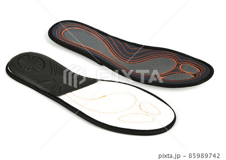 Foam and silicone insoles. Orthopedic insoles for athletic shoes isolated on white background. Foam and silicone insoles. Orthopedic insoles for athletic shoes isolated on white background. 85989742