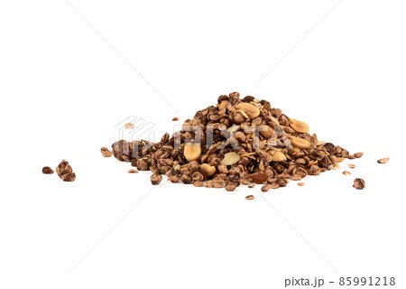 A bunch of muesli with chocolate and almonds on a white background. A bunch of muesli with chocolate and almonds on a white background. 85991218