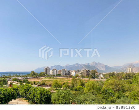 ariel panoramic view of old city and skyscrapers with the sea from the mountains ariel panoramic view of old city and skyscrapers with the sea from the mountains 85991330