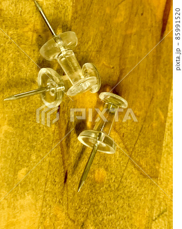 Push Pins in a pile on wooden desk Push Pins in a pile on wooden desk 85991520