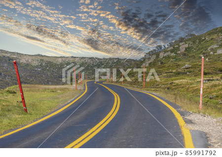 Photograph of a road winding through the Snowy Mountains in Australia Photograph of a road winding through the Snowy Mountains in Australia 85991792