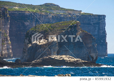 Watercolor drawing of Amazing Fungus and Gebla Rock cliffs with Rocky coastline in the Dwejra Bay beach near collapsed Azure window 85991932