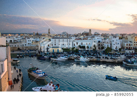 Watercolor drawing of boats in bay harbour of a seaside town Monopoli view from Castle of Carlo V, Puglia Apulia Watercolor drawing of boats in bay harbour of a seaside town Monopoli view from Castle of Carlo V, Puglia Apulia 85992055