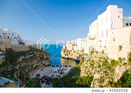 Watercolor drawing of Polignano a mare town with beach lama monachile cala porto and white buildings on grottos and cliffs in Puglia Apulia Watercolor drawing of Polignano a mare town with beach lama monachile cala porto and white buildings on grottos and cliffs in Puglia Apulia 85992058