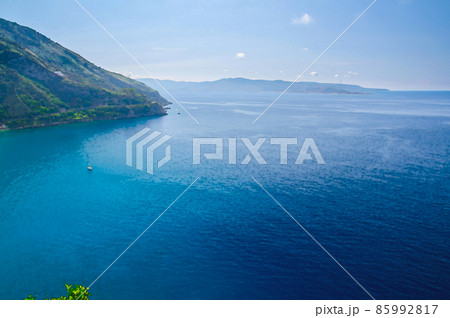 Watercolor drawing of Aerial top view of green hill and harbour of seaside town village Scilla, Tyrrhenian sea bay gulf coast shore, Sicilia island 85992817