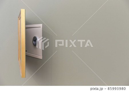 Wall safe hidden over painting with copy space Wall safe hidden over painting with copy space 85993980