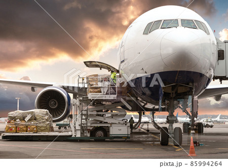 loading cargo into the aircraft before departure with nice sky 85994264