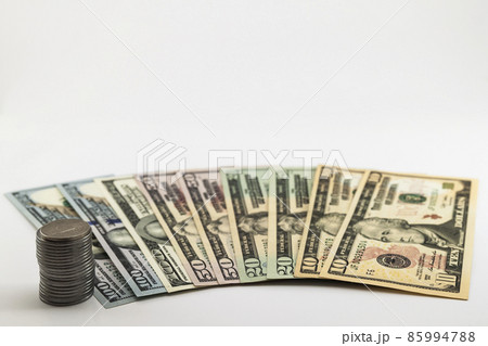 US american dollar money bills and coins cents spread on white background 85994788