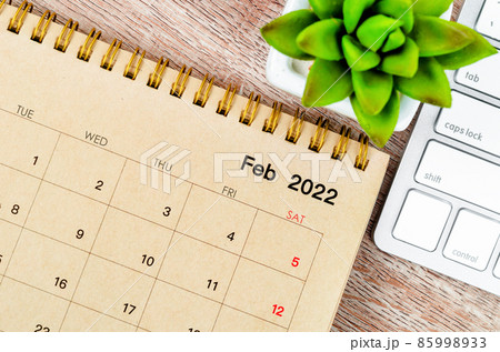 February 2022 desk calendar with keyboard computer 85998933