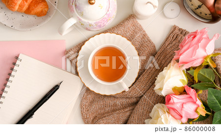Feminine workspace concept, A notebook with a set of English afternoon tea 86000008