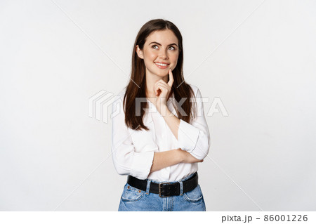 Portrait of female entrepreneur thinking, making choice, standing thoughtful, white studio background Portrait of female entrepreneur thinking, making choice, standing thoughtful, white studio background 86001226