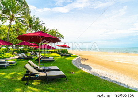 beach chair and umbrella with sea beach background beach chair and umbrella with sea beach background 86005356