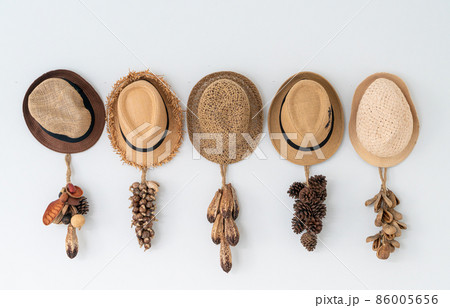 hat hanging on wall 86005656