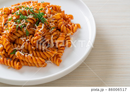 spirali or spiral pasta with tomato sauce spirali or spiral pasta with tomato sauce 86006517