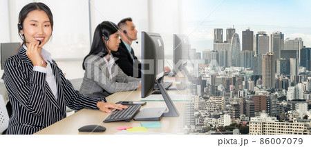 Business people wearing headset working in office broaden view Business people wearing headset working in office broaden view 86007079