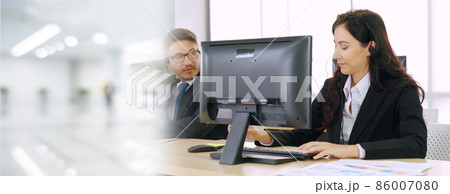 Business people wearing headset working in office broaden view Business people wearing headset working in office broaden view 86007080