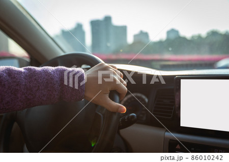 People driving car on city road 86010242