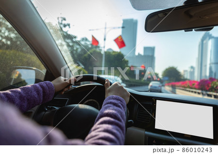 People driving car on city road People driving car on city road 86010243