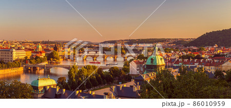 Prague, Czech republic - 08 14 2021: the old city with the Vltava river, at sunset Prague, Czech republic - 08 14 2021: the old city with the Vltava river, at sunset 86010959