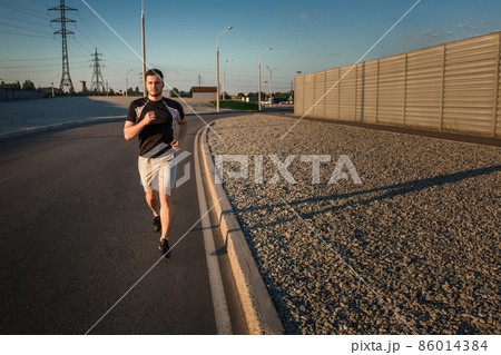 Full length portrait of athletic man running 86014384