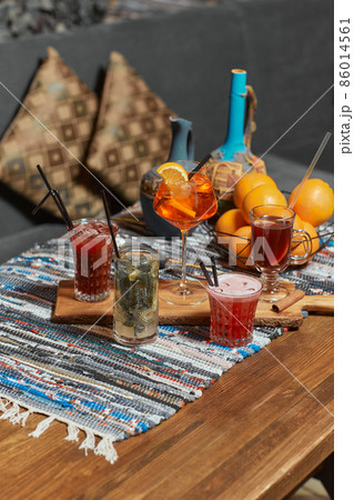 selection of drinks cocktails colourful on table with blurred background bar restaurant mixing bartender alcohol. selection of drinks cocktails colourful on table with blurred background bar restaurant mixing bartender alcohol. 86014561