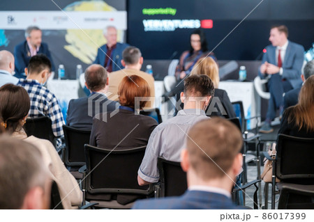 People sitting in conference room 86017399