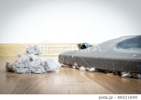 vacuum cleaner and dust on a wooden floor vacuum cleaner and dust on a wooden floor 86021690