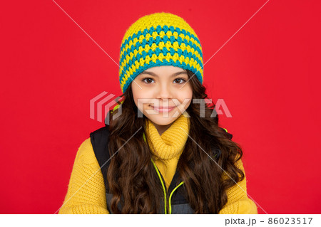 express positive emotion. winter fashion. smiling kid with curly hair in hat. teen girl 86023517