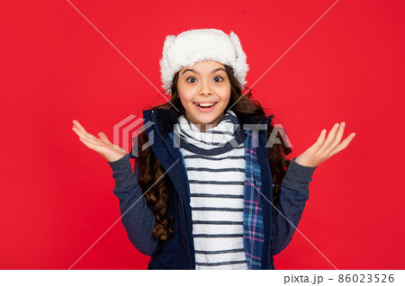 portrait of child wearing warm clothes. express positive emotion. winter fashion. amazed kid 86023526