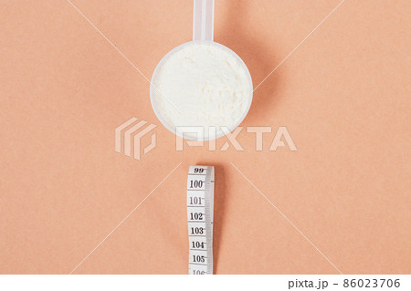 Flat lay composition muscle gain and healthy sport supplement Flat lay composition muscle gain and healthy sport supplement 86023706