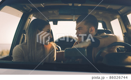 Happy boy and girl in the off road car during valentines day 86026744