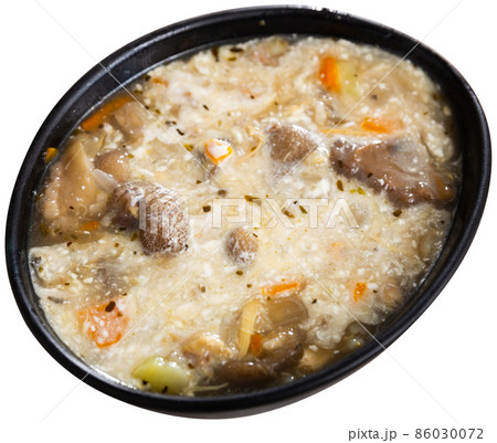 Top view of mushroom soup in bowl on white Top view of mushroom soup in bowl on white 86030072