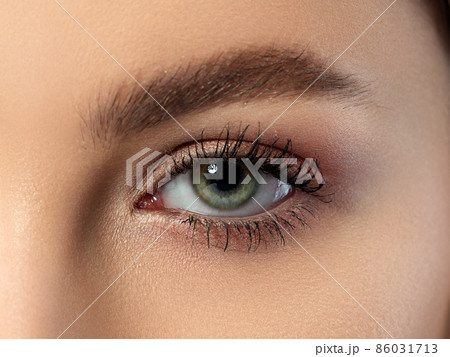Close up of green blue woman eye 86031713
