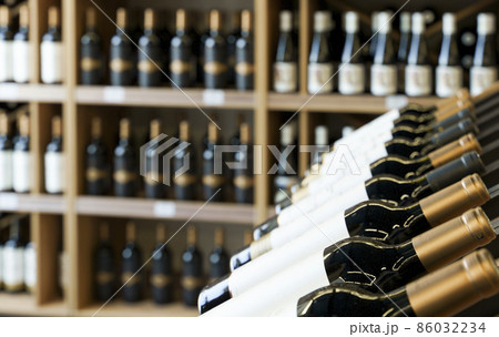 Wine bottles with blank labels on the counter of a liquor store. Wine background. 86032234