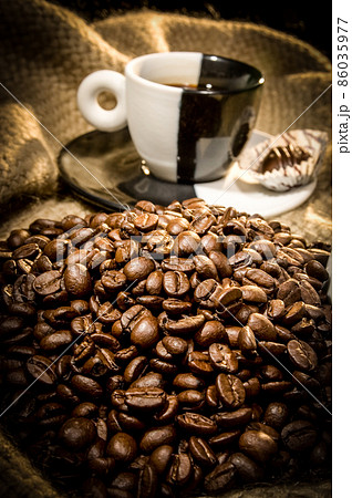 coffee cup and coffee beans on canvas coffee cup and coffee beans on canvas 86035977