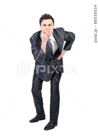 Frown man looking at camera with concentration Frown man looking at camera with concentration 86036034
