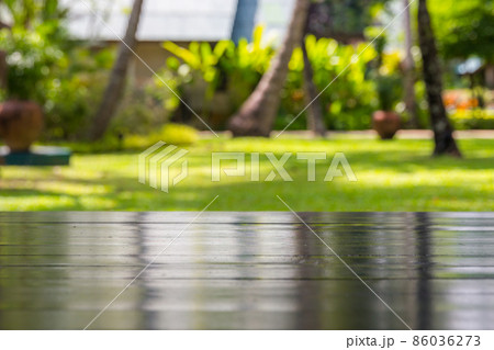 Top of wooden table with palm trees background 86036273