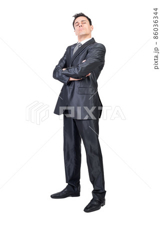 Arrogant boss with hands folded in white studio 86036344