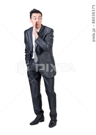 Businessman telling secret in studio. White background. Businessman telling secret in studio. White background. 86036375