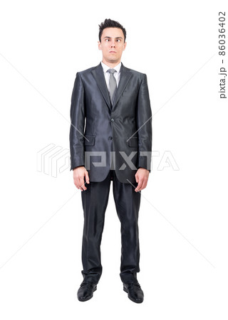 Funny businessman squinting against white background. White background. Funny businessman squinting against white background. White background. 86036402